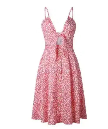 Pink floral print sundress with V-neck, tie front, and button-down skirt, perfect for summer outings.