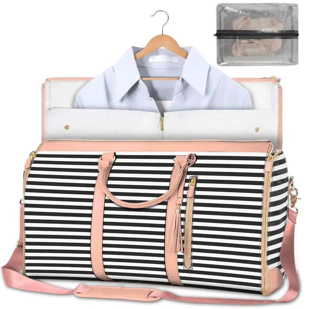 Striped duffel bag with pink handles, gold zippers, and hanging shirt compartment, includes mesh pouch