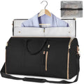 Black travel duffel bag with gold zippers, holding a suit on hanger and mesh organizer
