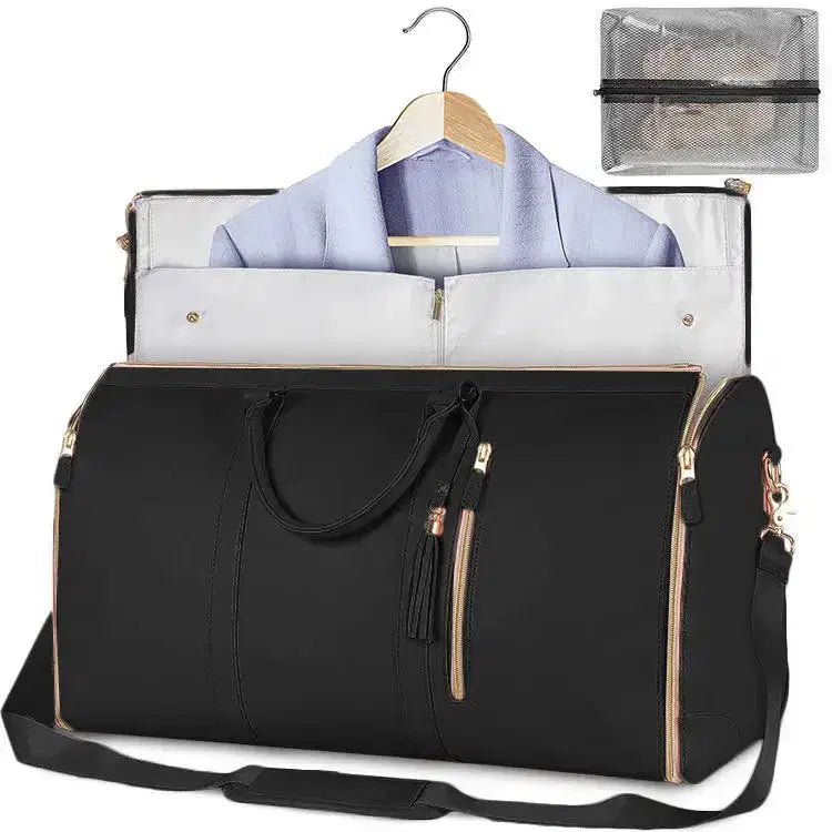 Black travel duffel bag with gold zippers, holding a suit on hanger and mesh organizer